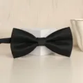 Classic black solid color bow tie for men, elegant formal wear accessory for weddings. - Black Fine Stripe Bowtie