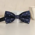 Navy blue polka dot men's bow tie variant, classic fabric formal accessory for weddings. - Blue Brilliant Bowtie
