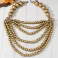 Stunning multi-layer statement necklace featuring large gold-tone wooden beads for women. - C23-142 Necklace Style