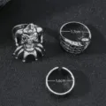Detail shot of 3-piece punk style skull and skeleton hand ring set, cool metal band. - Joker Skull Skeleton Hand Three-Piece Set (D23-032 R2-F3)