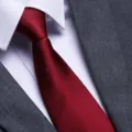 Red business necktie for men detail view showcasing fine textured fabric and tailoring - New Burgundy Fine Stripe Zipper