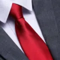 Silk red tie close-up detail for men formal business wear, elegant wedding necktie styling. - Bright Red Glossy Zipper