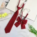 Burgundy JK Japanese style school tie and bow set, detailed close-up showing fabric and design. - Pre-Tied Tie + Bow / 7cm / Burgundy