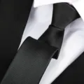Close-up detail of a classic black twill men's formal necktie showing fine fabric texture. - Fine Stripe Zipper / 6 cm Wide / Black