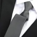 Detailed shot of a classic dark gray textured men business necktie for formal suits and events. - Matte Plain Zipper / 6 cm Wide / Gray