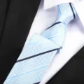 Light blue men tie with diamond pattern and diagonal stripes, perfect for professional business suits. - Blue Stripe Zipper / 6 cm Wide / Light Blue