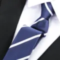Classic men's blue striped tie with white diagonal lines, perfect for business formal wear and suits. - Stripe Zipper / 6 cm Wide / Blue