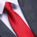 Elegant red textured men's necktie paired with white shirt and suit for formal business and weddings. - D15 Zipper