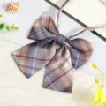 Close-up detail of Japanese JK uniform plaid bow tie, featuring classic multi-color check pattern. - JK037 Seabed Coral Bow Tie