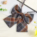 Detailed view of the JK Japanese plaid black bowtie with ribbons, perfect for school uniforms. - JK038 Dark Gray Orange Plaid Bow Tie