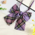 Close-up of a Japanese JK style plaid ribbon bow tie in purple, pink and black grid pattern. - Classic Yellow Purple Plaid Bow Tie