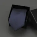 Navy blue striped necktie packaged in a black gift box, ideal for formal business wear. - 8cm Navy Meteor Zipper