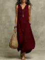 Close-up view of a sleeveless maroon maxi dress paired with a woven straw bag for summer. - S / Dresses / Burgundy