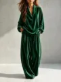 Close-up detail of dark green velvet long sleeve lapel top and wide leg trousers set. - Green