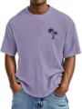 Detail shot of men's waffle knit t-shirt with tropical palm tree print, casual crew neck design. - Purple