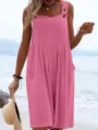 Pink sleeveless wide-leg jumpsuit detail showing button straps and soft fabric texture. - Peach