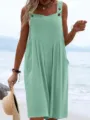 Detail shot showing the sleeveless design, buttons, and relaxed wide leg cut of the jumpsuit. - Cyan