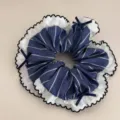 Navy blue stripe hair scrunchie with white lace ruffle edge and sweet bows detail close-up. - Striped Petal Edge Scrunchie
