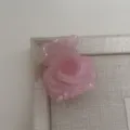 Detailed close-up of a pink rose hair claw clip, perfect for elegant half-up hairstyles. - Mermaid Light Pink