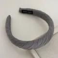Detailed shot of grey pleated fabric headband, handmade style daily hair accessory for women. - Gray