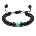 8mm mat zwarte stenen kralen armband met turquoise centrale kraal en verstelbaar koord. - Mat Zwart En Lichtblauw Turkoois