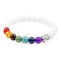 Chakra gemstone beaded bracelet with silver Buddha head charm and elegant white stone beads. - White Porcelain