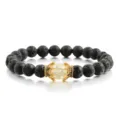 Schwarzes Lavastein-Perlenarmband mit goldenem Kronen-Kristall-Akzent und Stretchband. - Gelb