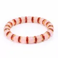 Braccialetto di perline in quarzo rosa dolce con distanziatori in strass rossi, cristallo. - Castone Dorato Strass Rosso
