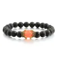 Schwarzes Lavastein Perlenarmband mit Legierung Krone und rotem Stein, elastischer Modeschmuck. - Orangerot