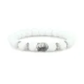 White beaded bracelet with alloy Buddha head charm and metal spacer rings for daily wear. - White Porcelain