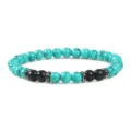 Turquoise en zwarte kralen stretch armband met metalen spacers voor dagelijkse stijl. - Turkoois