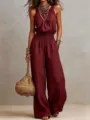 Women summer casual sleeveless solid color halter smocked wide leg jumpsuit detail view. - S / Burgundy