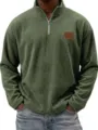 Detailed view of olive green corduroy quarter zip pullover shirt close up texture. - Dark Green