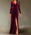 Detail view of the velvet long sleeve wrap dress with high slit and elegant V-neckline. - Burgundy