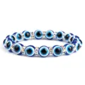 Prachtige boze oog kristal kralen armband met blauwe glaskralen en strass steentjes. - Gouden Rand Strass / AB Wit