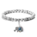Bracelet de perles blanches avec pendentif éléphant mauvais œil bijou ethnique - Howlite à Lignes Noires
