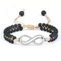 Bracelet double en perles mates noires avec charme infini argenté et cordon réglable tressé. - Double Infini Mat