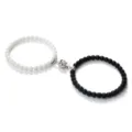 Magnetic couple bracelet set featuring matching black and white beads with a floral magnetic clasp. - Matte White Ceramic-Look