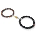 Magnetic couple bracelets set with tiger eye and black beads featuring gold silver handshake. - Matte Tiger Eye
