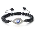 Bracelet tissé élégant en perles craquelées noires avec breloque œil grec en strass argenté. - Pierre Craquelée Noire Argent