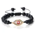 Bracelet de perles noires œil maléfique avec pendentif strass rouge et cordon tressé. - Turquoise Noire Ligne Blanche Or