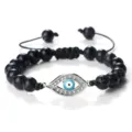 Bracelet de perles noires avec pendentif œil maléfique argenté et cordon réglable. - Pierre Tachetée Noire (Mauvais Oeil Argenté)