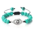 Bracelet en perles de turquoise avec breloque œil maléfique en strass et cordon noir réglable. - Turquoise Verte Argent