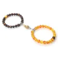 Magnetic matching hand-in-hand bead bracelets for couples, trendy silver and gold design. - Tiger Eye Faux Amber