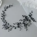 Close-up of black crystal hair vine, detailed rhinestones and beads for elegant hairstyles. - Black
