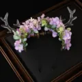 Close-up detail of the forest style reindeer antler headband with purple floral and green leaves. - Lilac Small