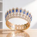 Close-up detail of the luxury baroque crown featuring sparkling crystals and blue gemstones. - Gold Blue