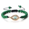 Bracelet en perles vertes avec pendentif œil grec doré en strass et cordon réglable. - Malachite (Mauvais Oeil Doré)