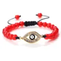 Bracelet tressé de perles de pierre rouge fait main avec charme œil maléfique en cristal. - Jade Rouge Or