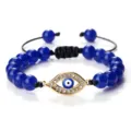 Bracelet de perles bleues avec pendentif œil maléfique en strass doré et cordon tressé réglable. - Lapis-Lazuli Or